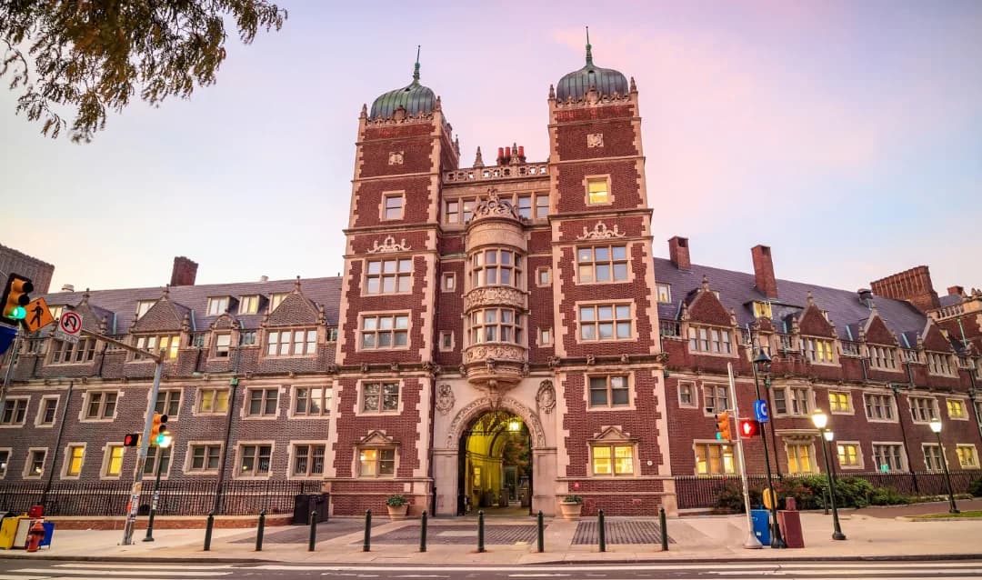 Brick buildings and a gated archway on the University of Pennsylvania campus