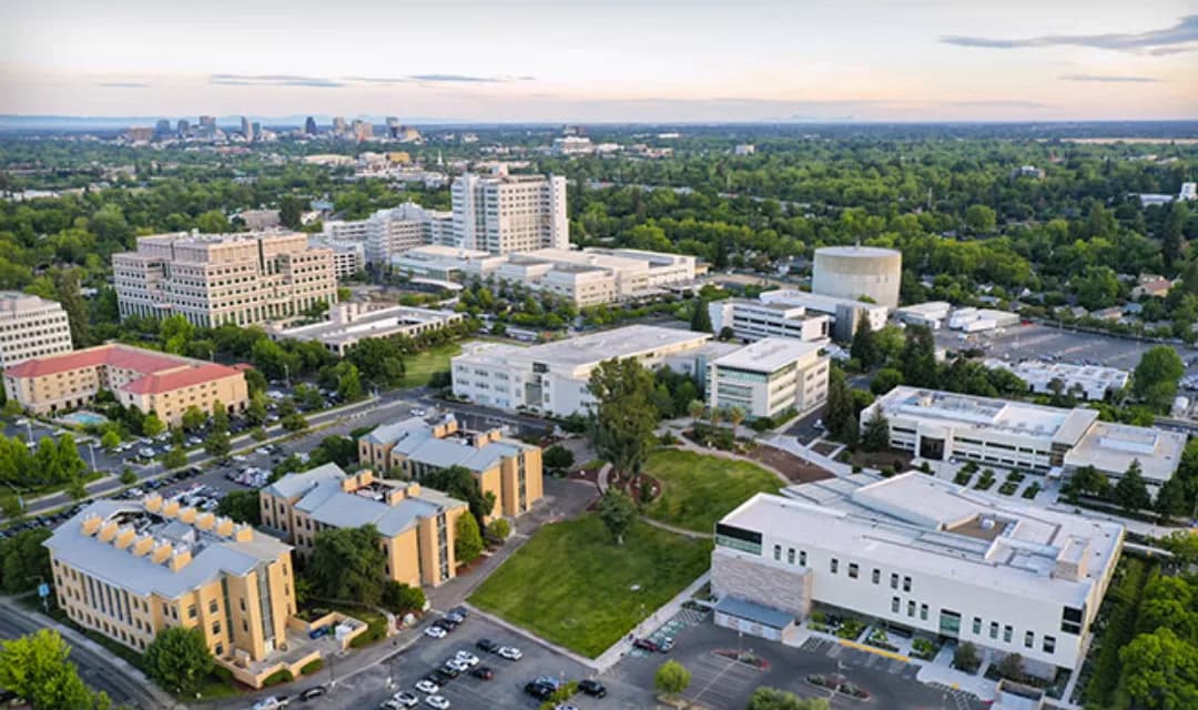 Aerial view of the UC Davis campus and Sacramento skyline